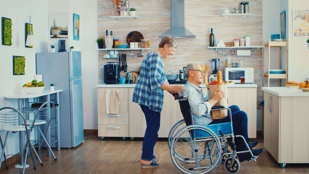 pushing invalid senior while doing community nursing care | community access