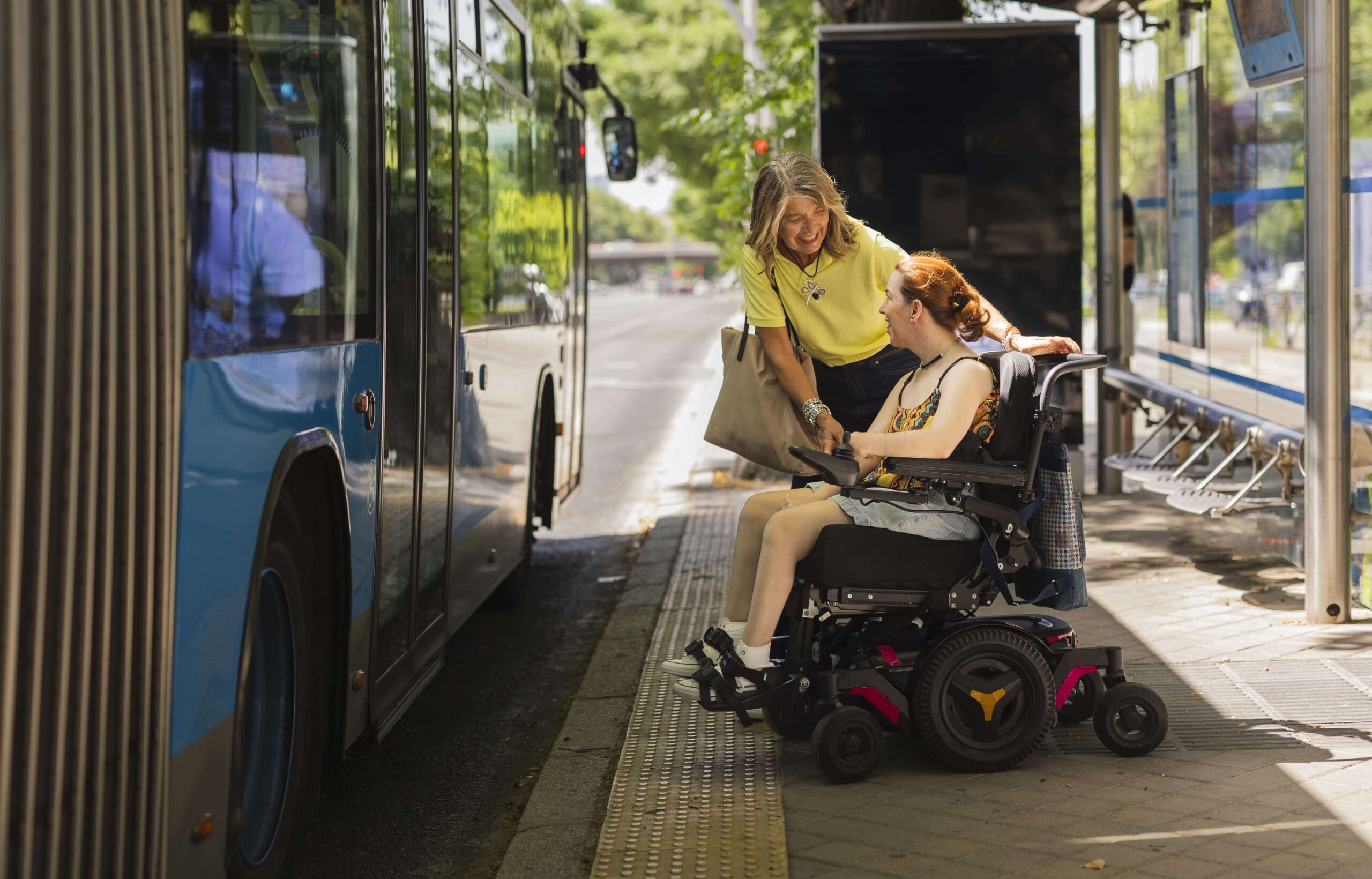 woman helping disabled | Assist Travel Transport