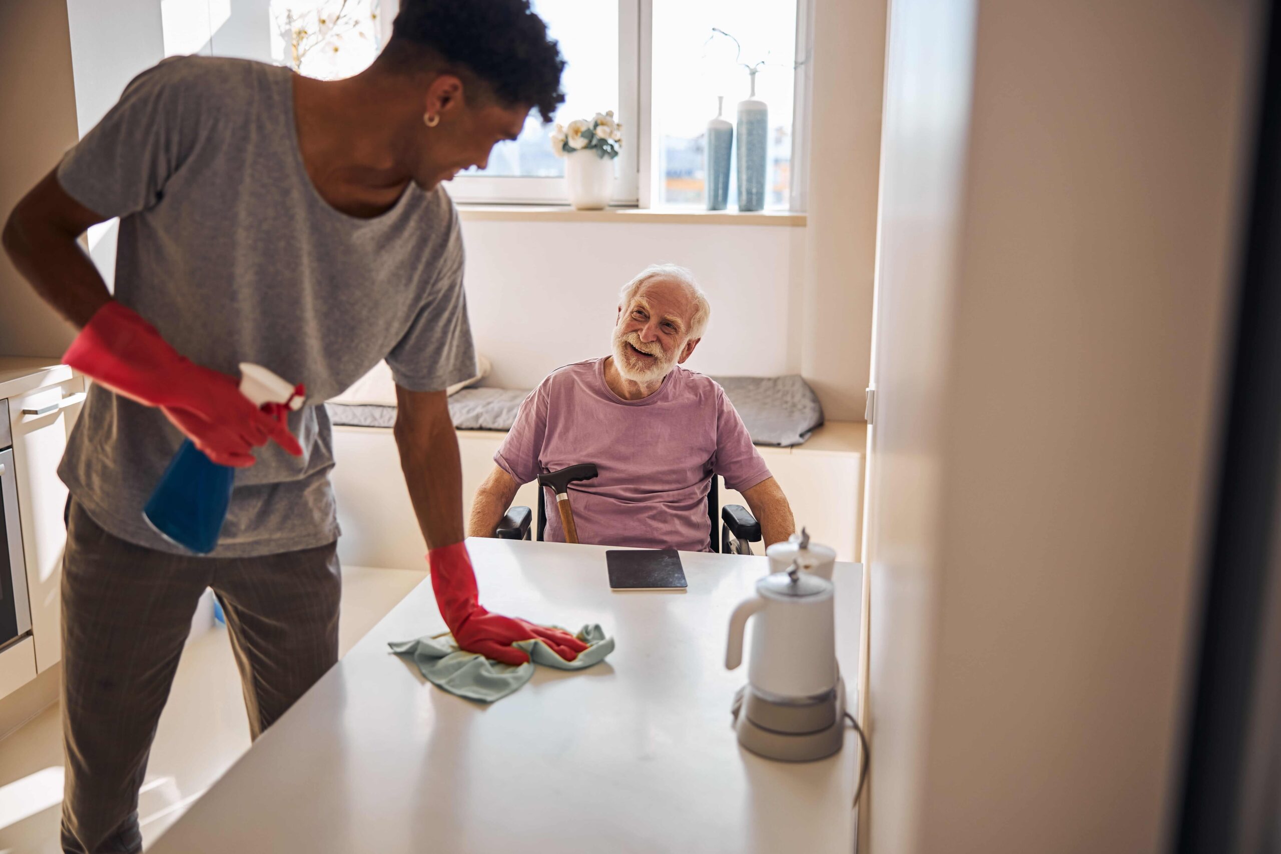 young man doing the cleaning in the kitchen and Household Tasks and in home support
