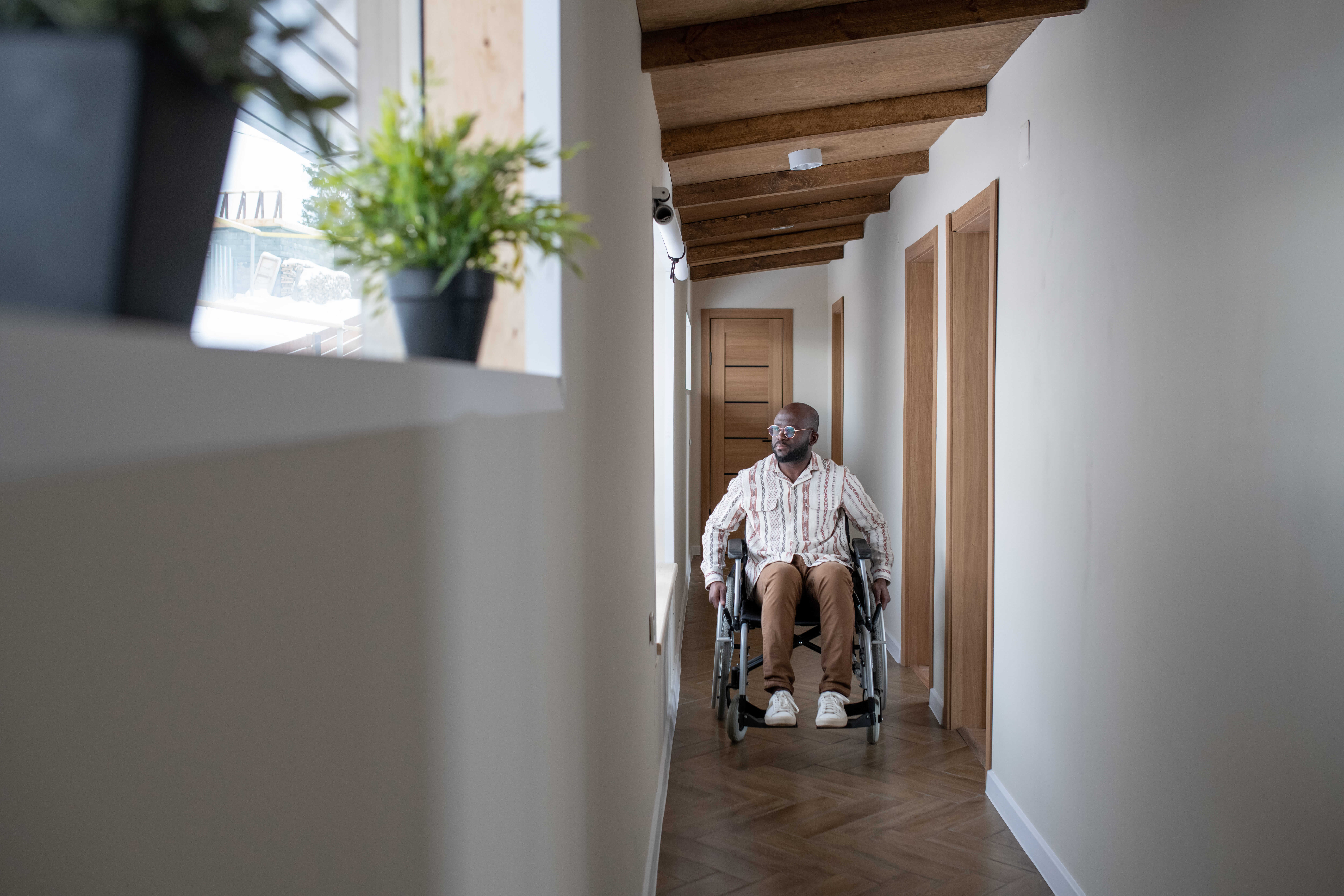 a man moving around to corridor | Accommodation Tenancy and Home Modification with in home support