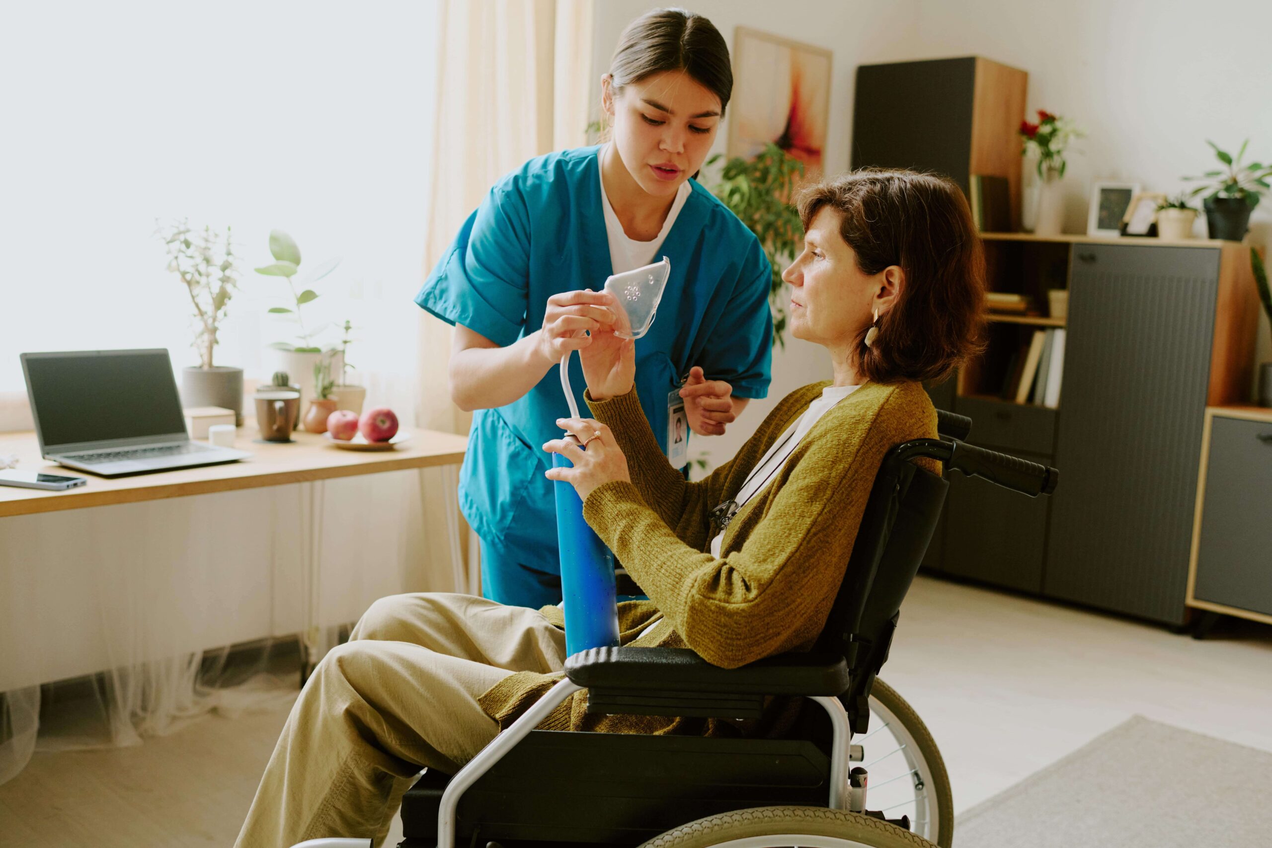 assisting elderly woman with daily activities at assist life stage transition