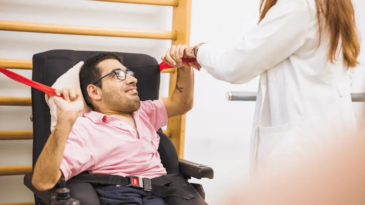 disabled man undergoing physiotherapy